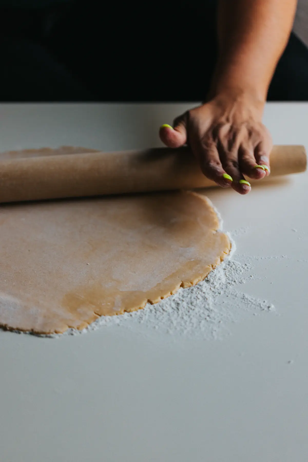 Rolling out dough on a floured counter